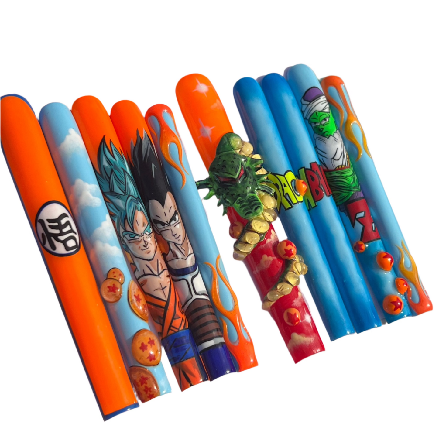 A pack of nail art kits featuring characters from the anime series 'Dragon Ball Z'. The pack includes decals for fingers with various colorful designs and character motifs.